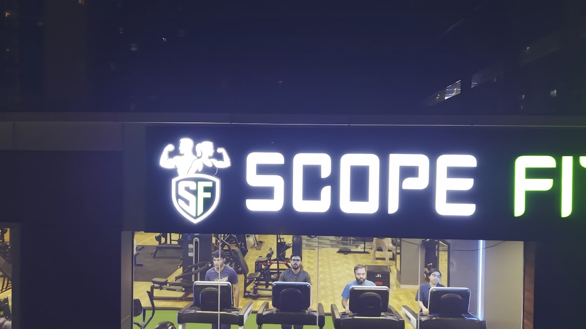 Scope Fitness illuminated storefront sign